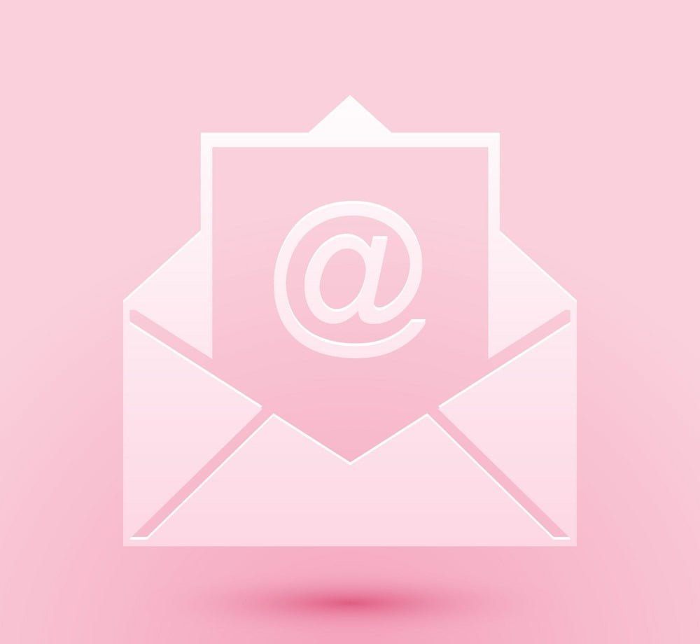 Paper cut Mail and e-mail icon isolated on pink background. Envelope symbol e-mail. Email message sign. Paper art style. Vector