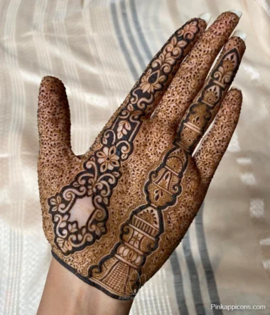 A hand adorned with intricate henna designs, showcasing a beautiful mehndi aesthetic.