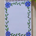 A notebook featuring a creative front page design with blue flowers and green leaves, ideal for assignments.