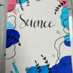 Colorful front cover of a science notebook featuring a vibrant design and decorative elements.