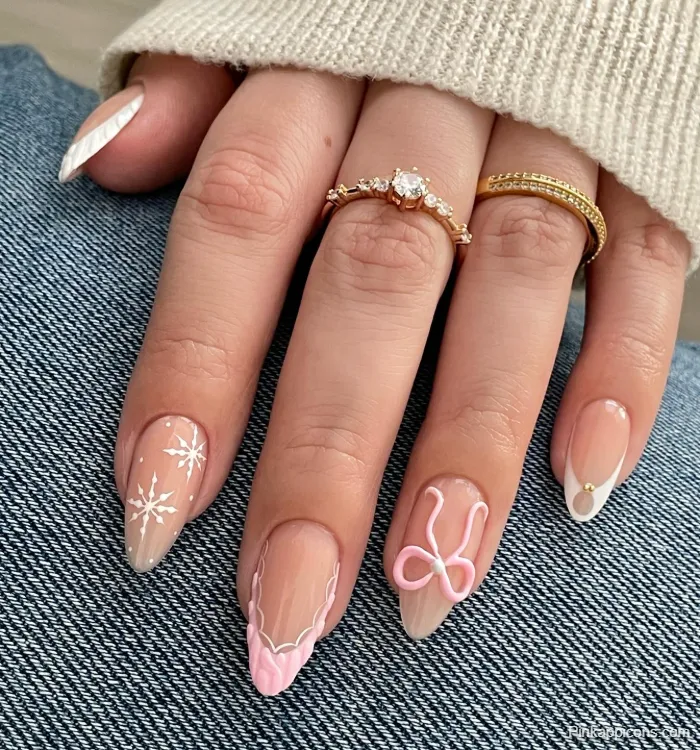 Almond Nails Elegant Winter Nail Art with Snowflakes, Pink Swirl, and Gold Details