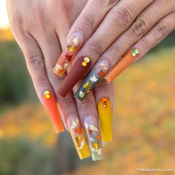 Elegant Fall Nails Long Acrylics with Autumn Leaf Decals and Gold Flakes