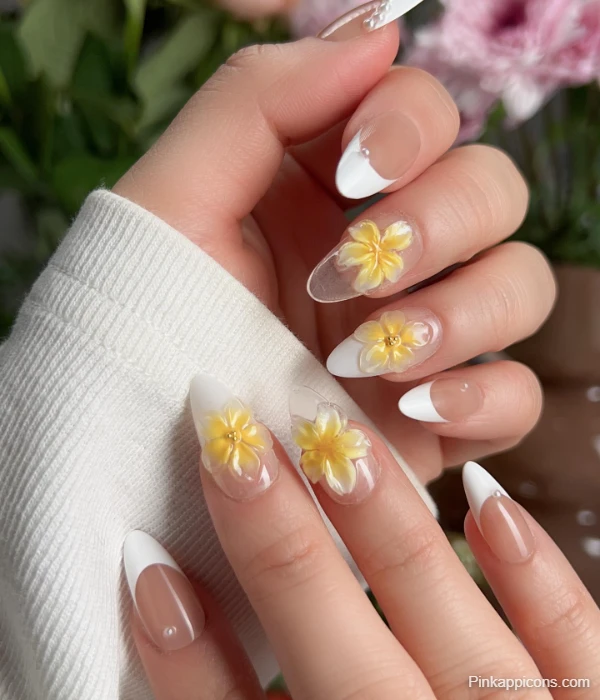 Elegant White French Tip Nails with 3D Yellow Plumeria Flowers