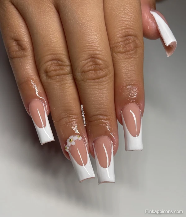 Elegant White French Tip Nails with Delicate Gold and White Flower Accent