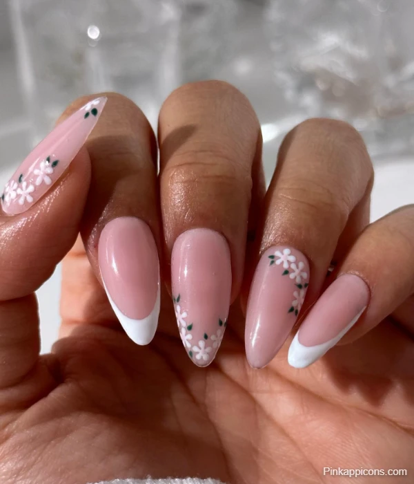 Elegant White French Tip Nails with Delicate White Flowers and Green Leaves