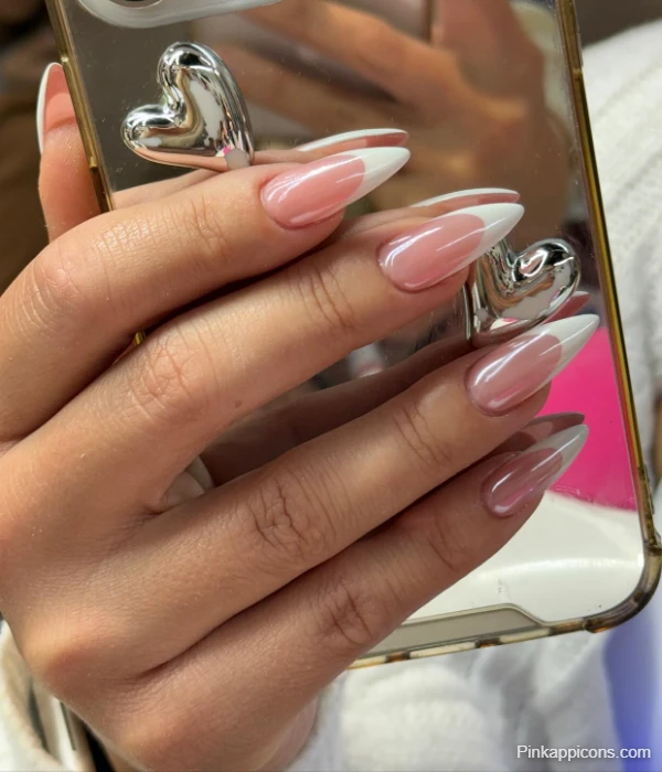 Elegant White French Tip Stiletto Nails with a Subtle Pink Base
