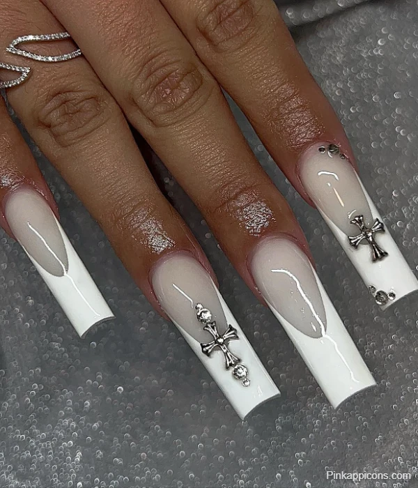 Glamorous White French Tip Nails with Silver Cross Charms and Rhinestones