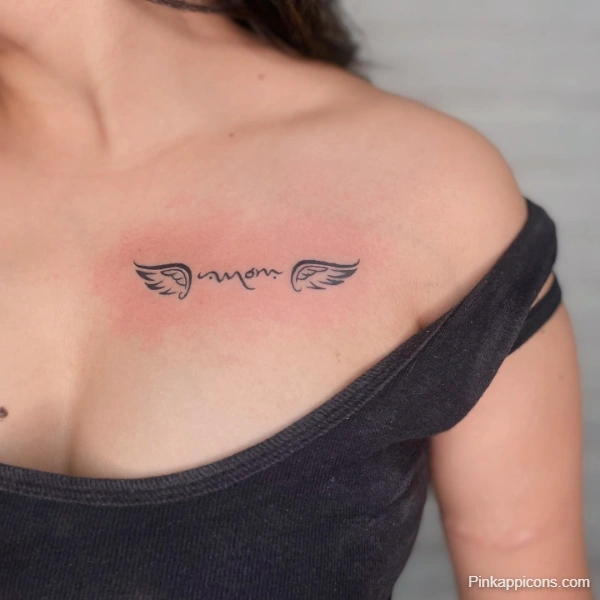 Small Angel Wings with Script Tattoo Idea Delicate Chest Piece