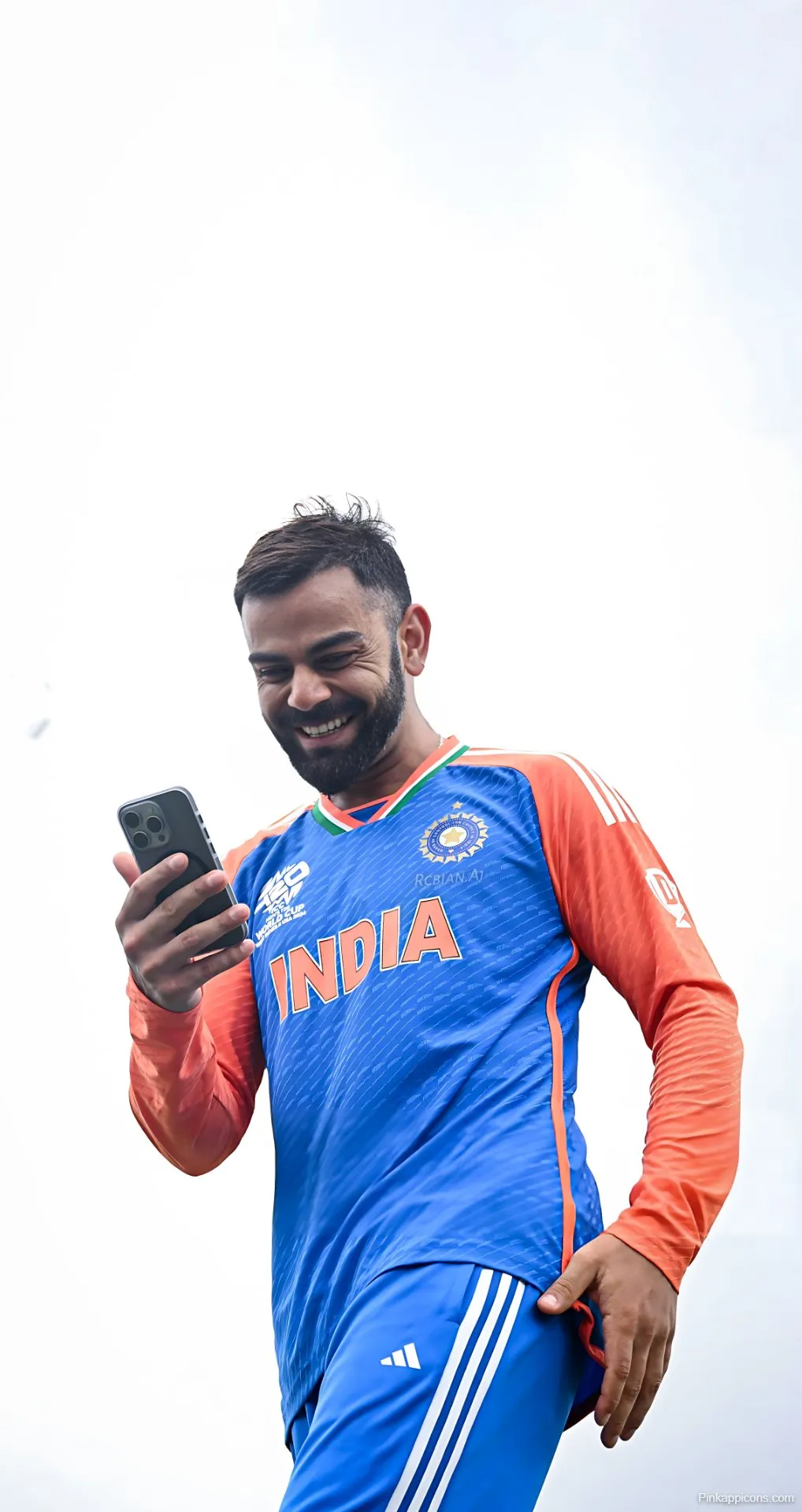 Virat Kohli Laughing at Phone Wallpaper Joyful Indian Cricket Star