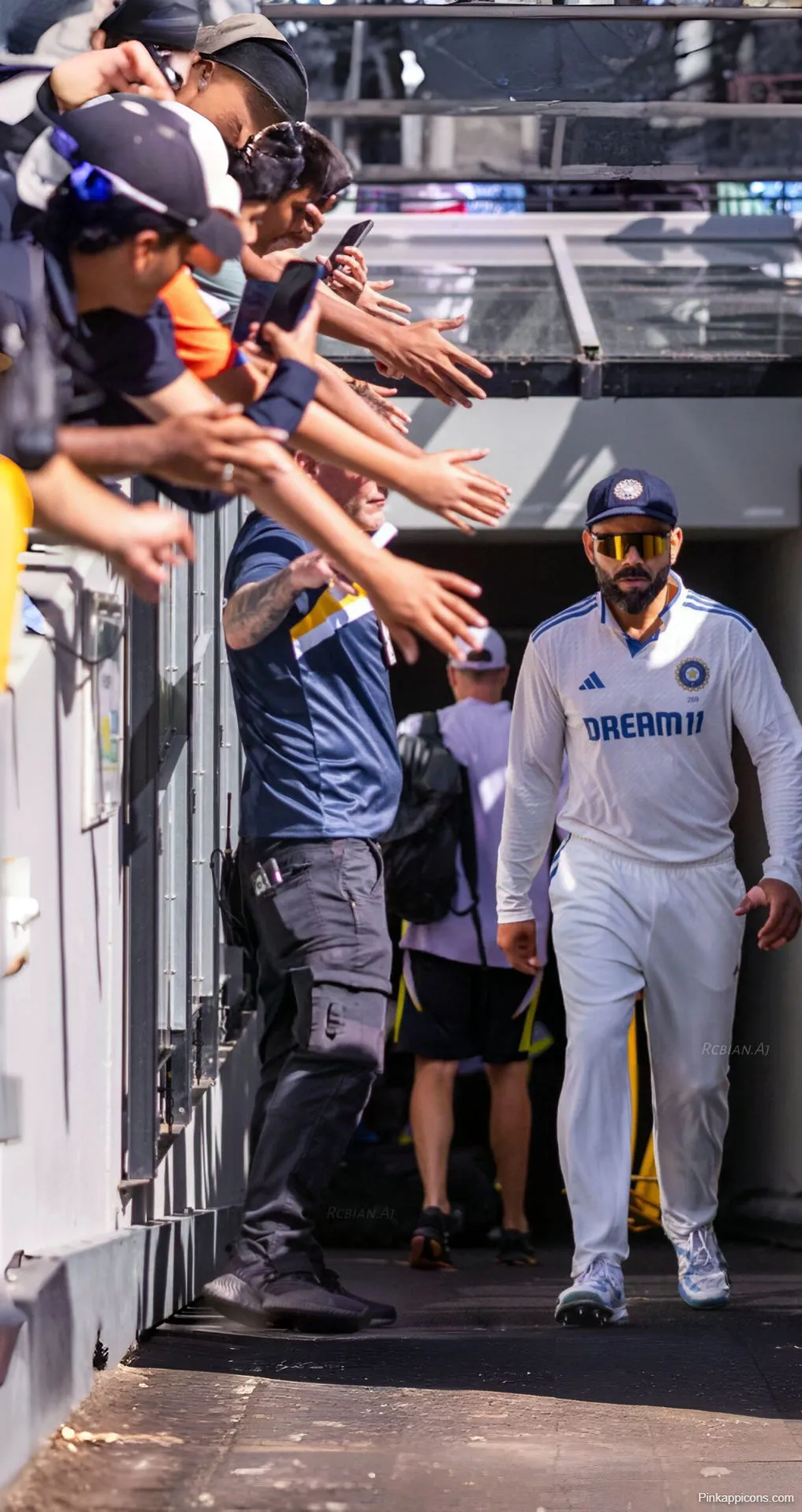 Virat Kohli Walking Through Tunnel Wallpaper Acknowledging Fans