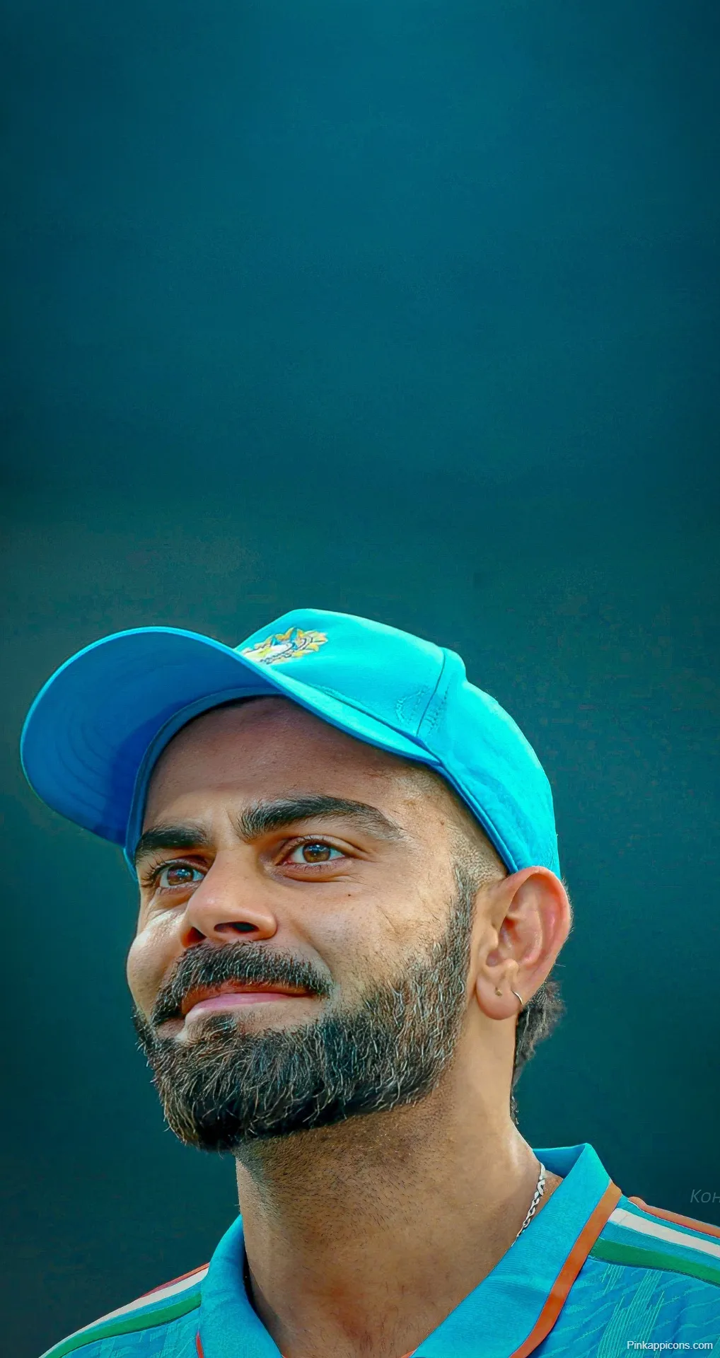 Virat Kohli Wallpaper Focused Indian Cricket Star in Blue