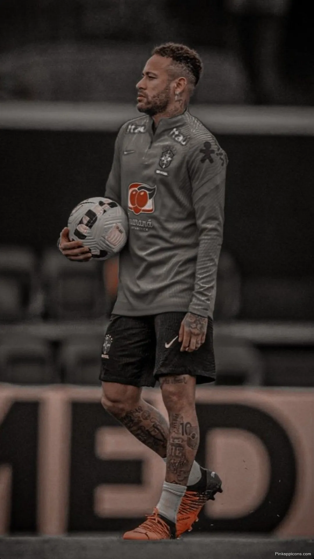Neymar Wallpaper A focused shot of Neymar Jr. holding a soccer ball great for your phone wallpaper Neymar Wallpaper A focused shot of Neymar Jr. holding a soccer ball, great for your phone wallpaper.