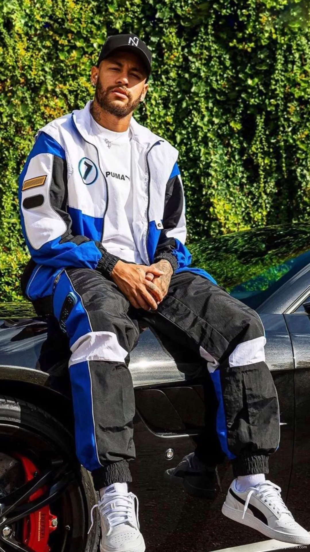 Neymar Wallpaper A stylish shot of Neymar Jr. sitting on a black sports car great for your phone wallpaper Neymar Wallpaper A stylish shot of Neymar Jr. sitting on a black sports car, great for your phone wallpaper.