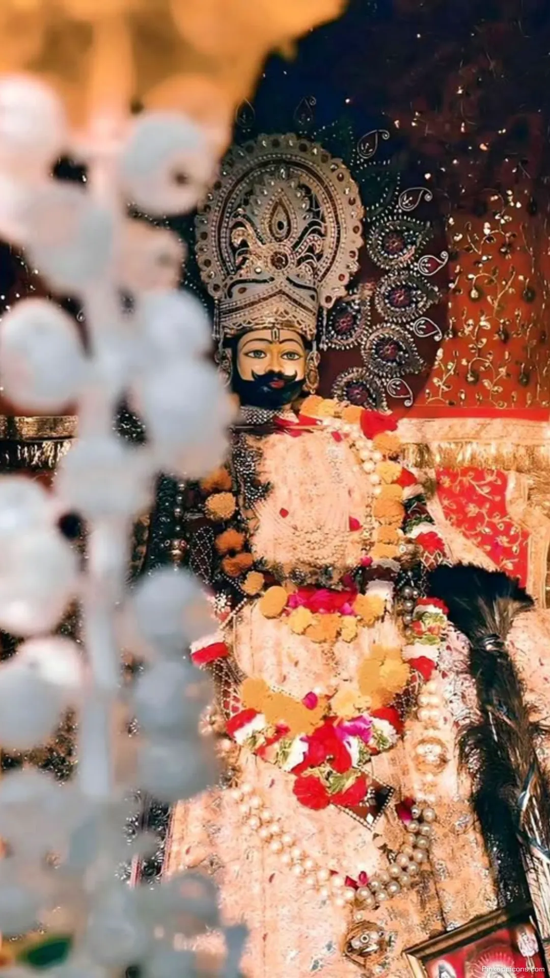 Regal Darshan Jeweled Crown and Garlands Enhance This Majestic Khatushyam Ji Wallpaper for Phones Regal Darshan Jeweled Crown and Garlands Enhance This Majestic Khatushyam Ji Wallpaper for Phones