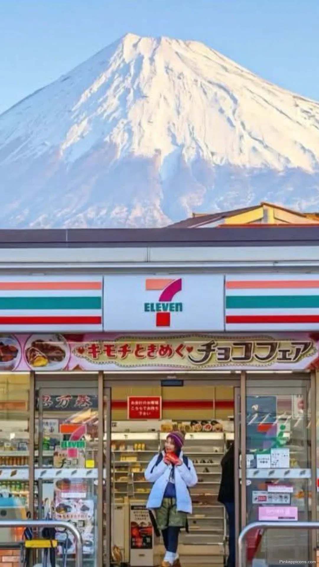 Snow capped Mount Fuji contrasts with a lively 7 Eleven store a perfect urban nature Tokyo wallpaper Snow-capped Mount Fuji contrasts with a lively 7-Eleven store, a perfect urban-nature Tokyo wallpaper