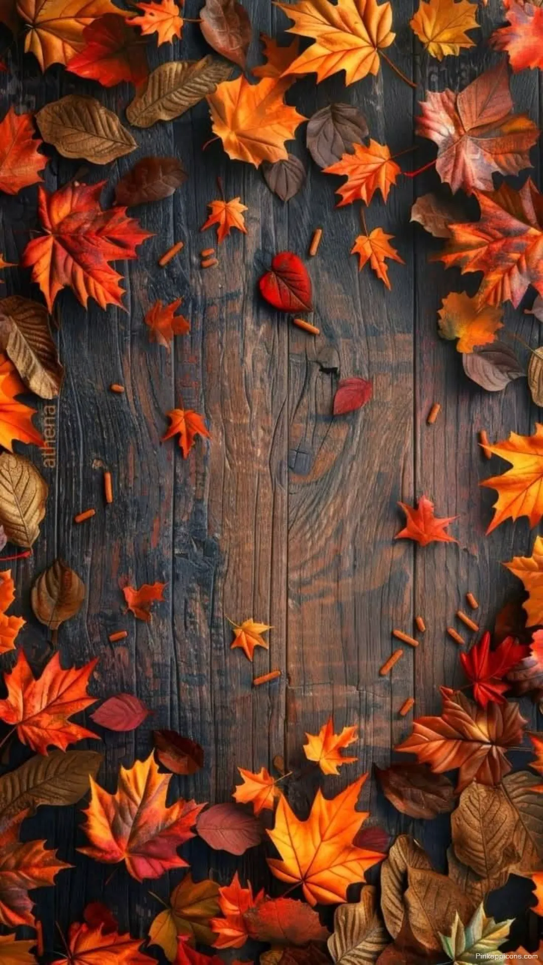 Cozy Autumn Wallpaper A Beautiful Arrangement of Red and Orange Leaves on a Warm Wooden Surface for Phones Cozy Autumn Wallpaper A Beautiful Arrangement of Red and Orange Leaves on a Warm Wooden Surface for Phones