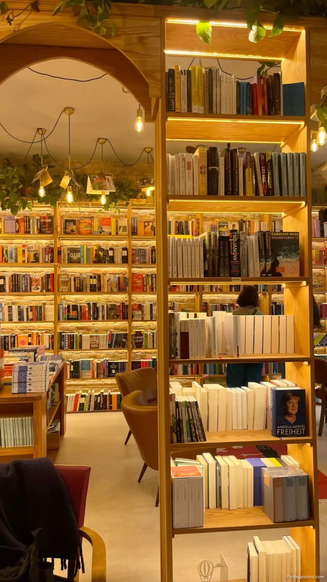 Cozy and well lit bookstore book wallpaper a perfect readers escape for your phone Cozy and well-lit bookstore book wallpaper, a perfect reader’s escape for your phone.