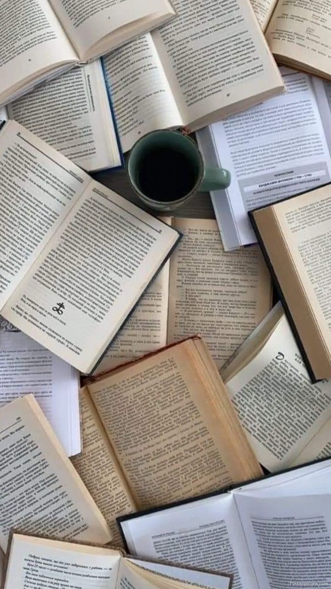 Cozy study session book wallpaper with a warm cup of coffee surrounded by open novels Cozy study session book wallpaper with a warm cup of coffee surrounded by open novels.