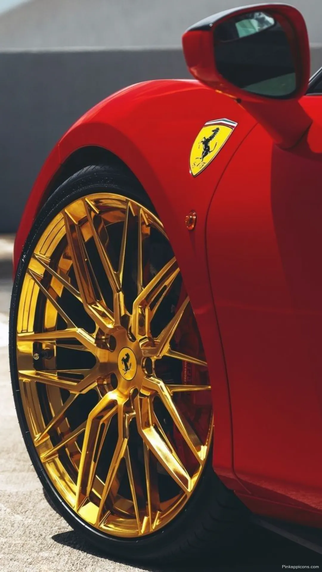 High Performance Ferrari Wheel and Logo wallpaper Stunning gold accents on a classic red sports car perfect for your phone High-Performance Ferrari Wheel and Logo wallpaper Stunning gold accents on a classic red sports car, perfect for your phone