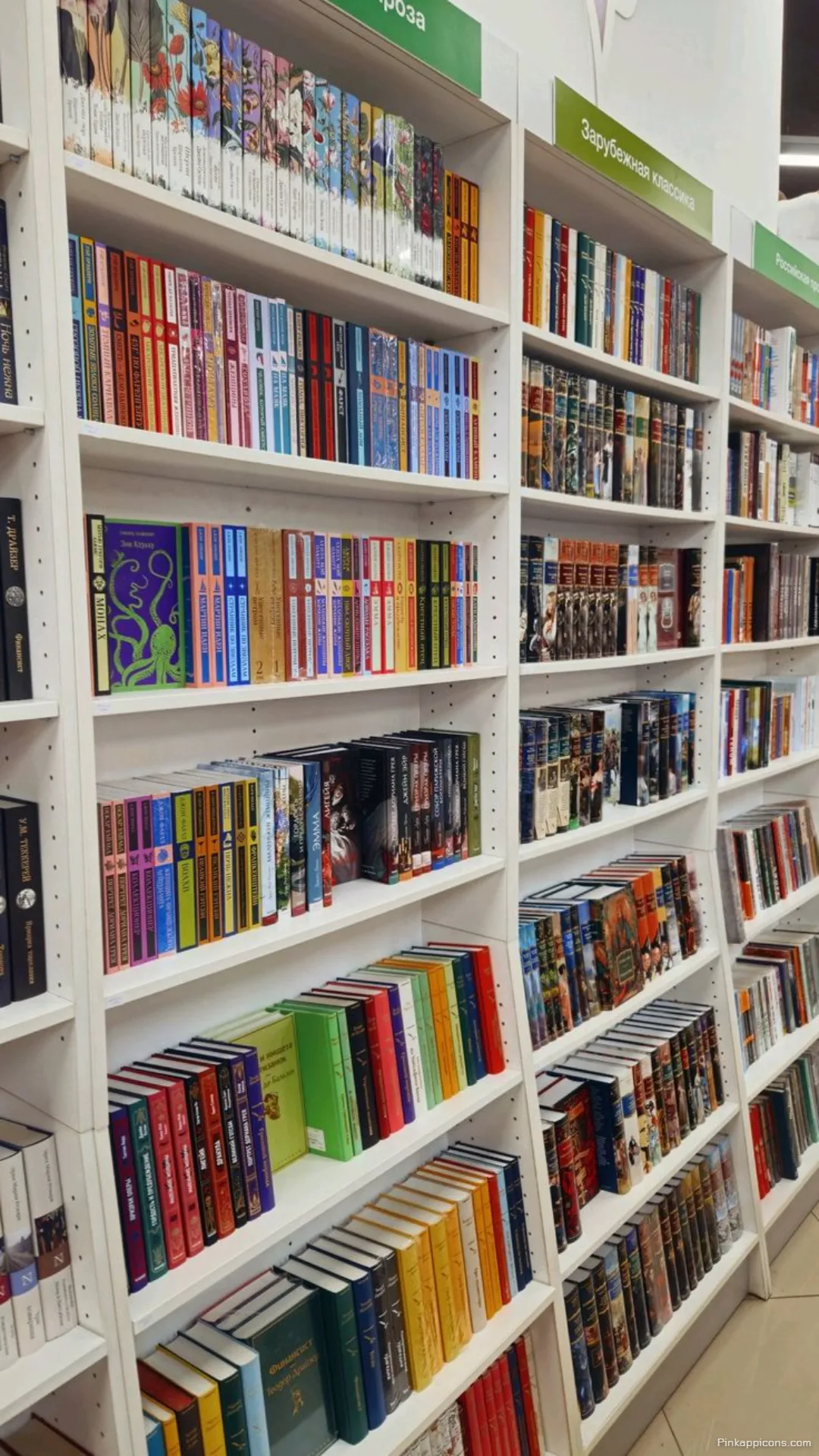 Modern bookstore aisle book wallpaper a readers paradise of colorful organized novels Modern bookstore aisle book wallpaper, a reader’s paradise of colorful organized novels.