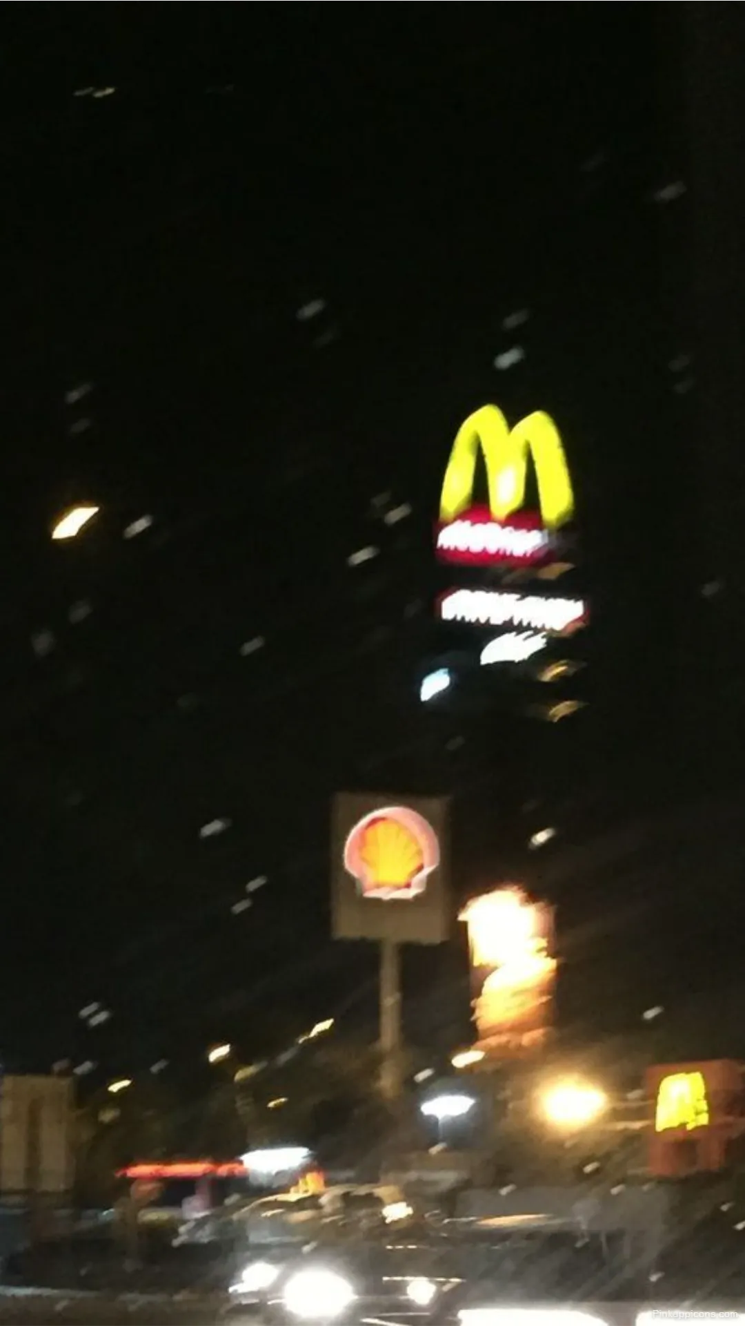 Urban Night Blurry Wallpapers Glowing McDonalds Shell Signs with Defocused City Lights Mobile Background Urban Night Blurry Wallpapers Glowing McDonald’s & Shell Signs with Defocused City Lights Mobile Background.
